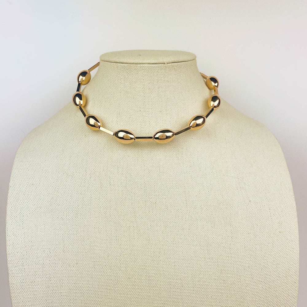 Gold Sphere Choker minimalist choker necklace with polished clasp on neck