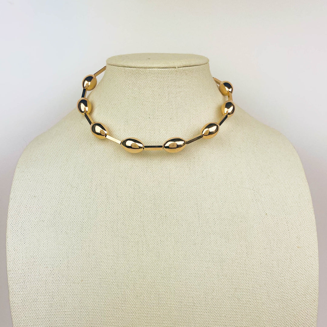 Gold Sphere Choker minimalist choker necklace with polished clasp on neck