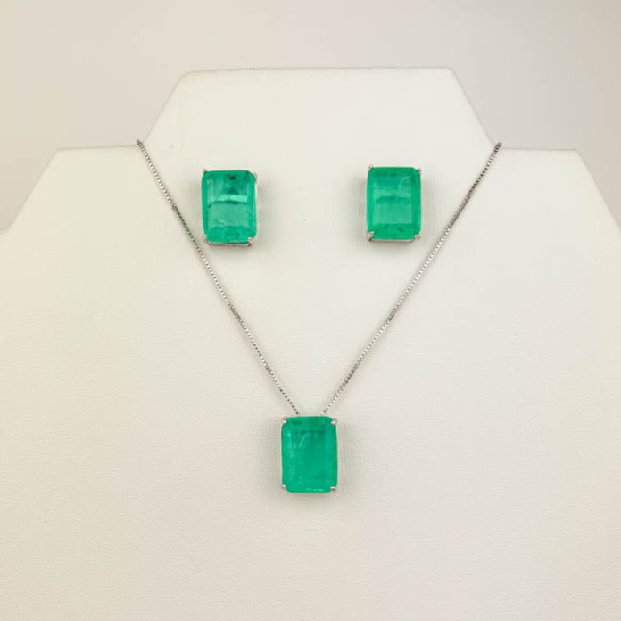 green fusion jewelry set with square green stone earrings and matching necklace on mannequin bust