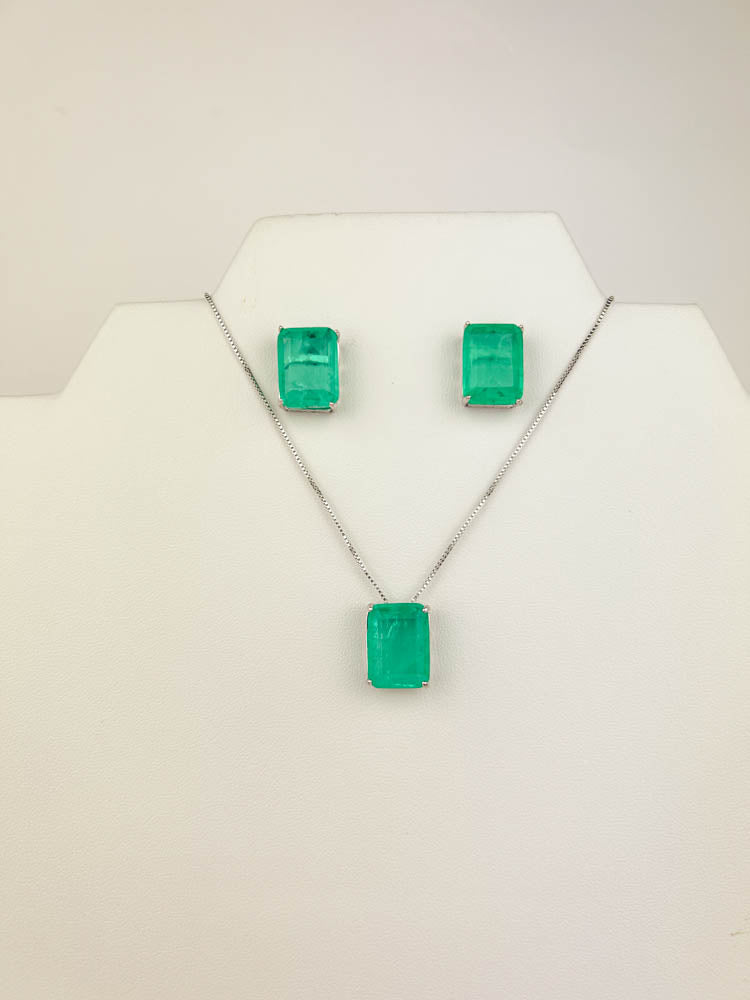 green fusion jewelry set—white rhodium square green stud earrings and matching pendant necklace on display