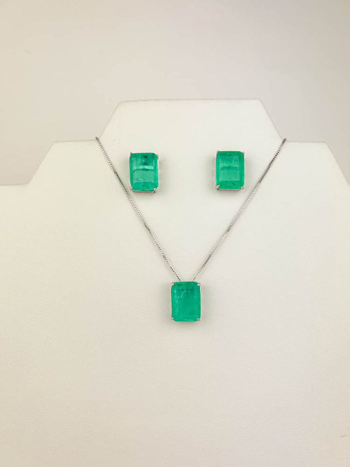 green fusion jewelry set—white rhodium square green stud earrings and matching pendant necklace on display