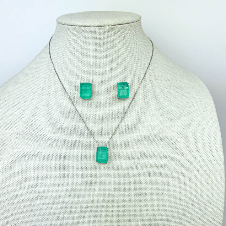 green fusion jewelry set featuring square green fusion stones: earrings and pendant necklace displayed on mannequin