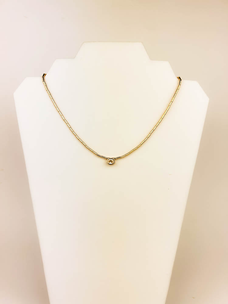 Nelly Necklace gold-plated teardrop crystal pendant on mannequin display