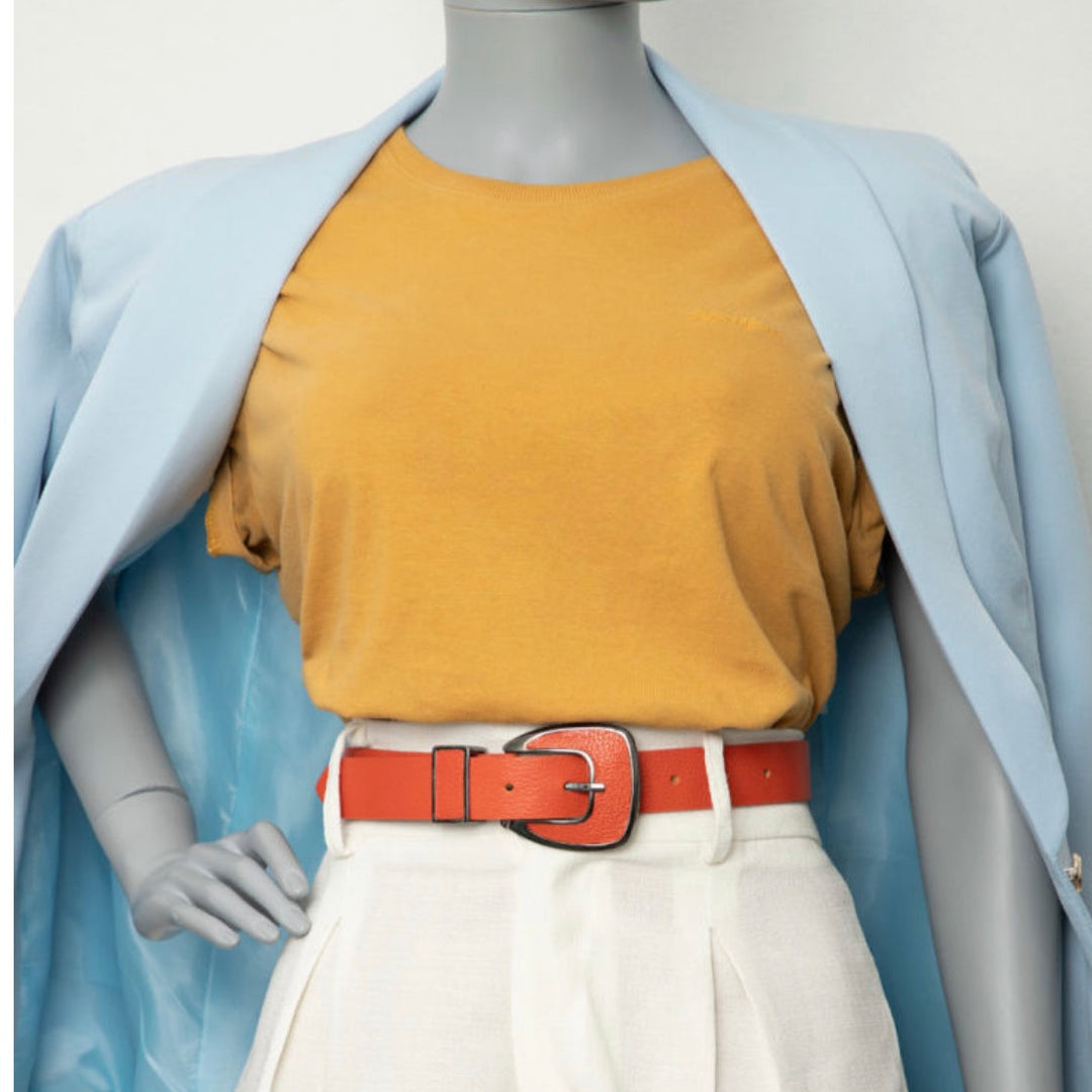 Orange leather belt with metal buckle for versatile everyday style