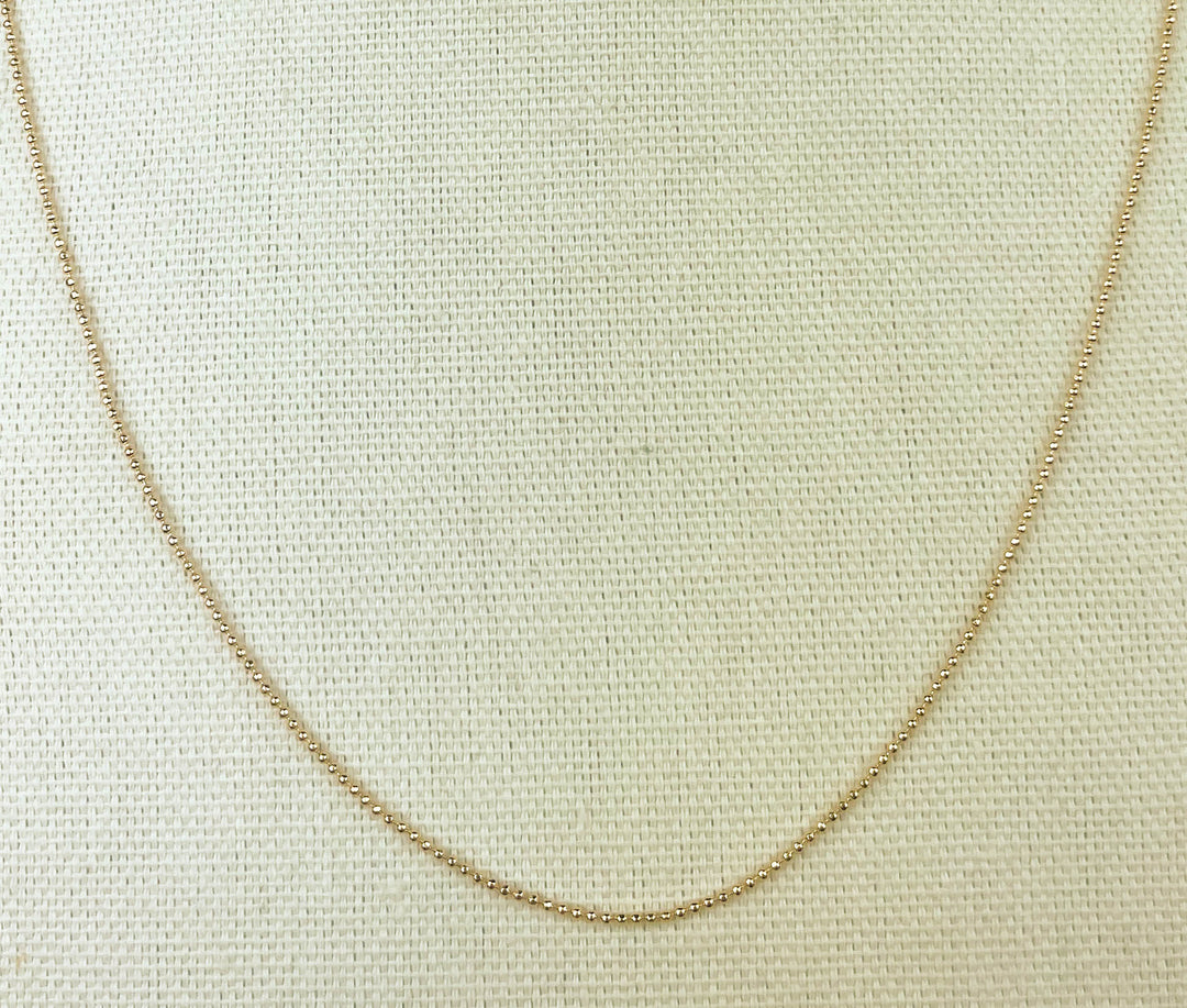 Small Bead Necklace in radiant 18k gold for layering and special occasions