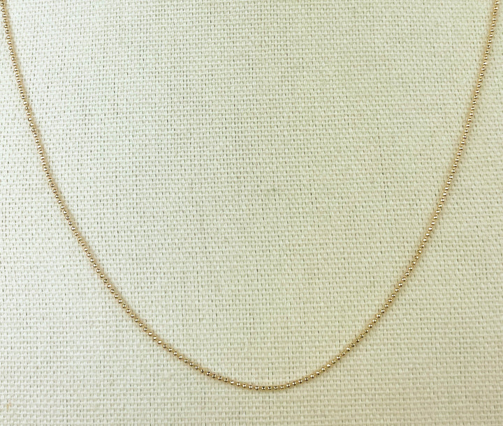 Small Bead Necklace in radiant 18k gold for layering and special occasions