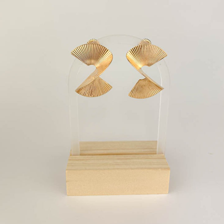 A  pair of elegant spiral earrings, each beautifully crafted with a textured, wave-like design. The earrings are plated in 18k gold, providing a luxurious and sophisticated appearance.